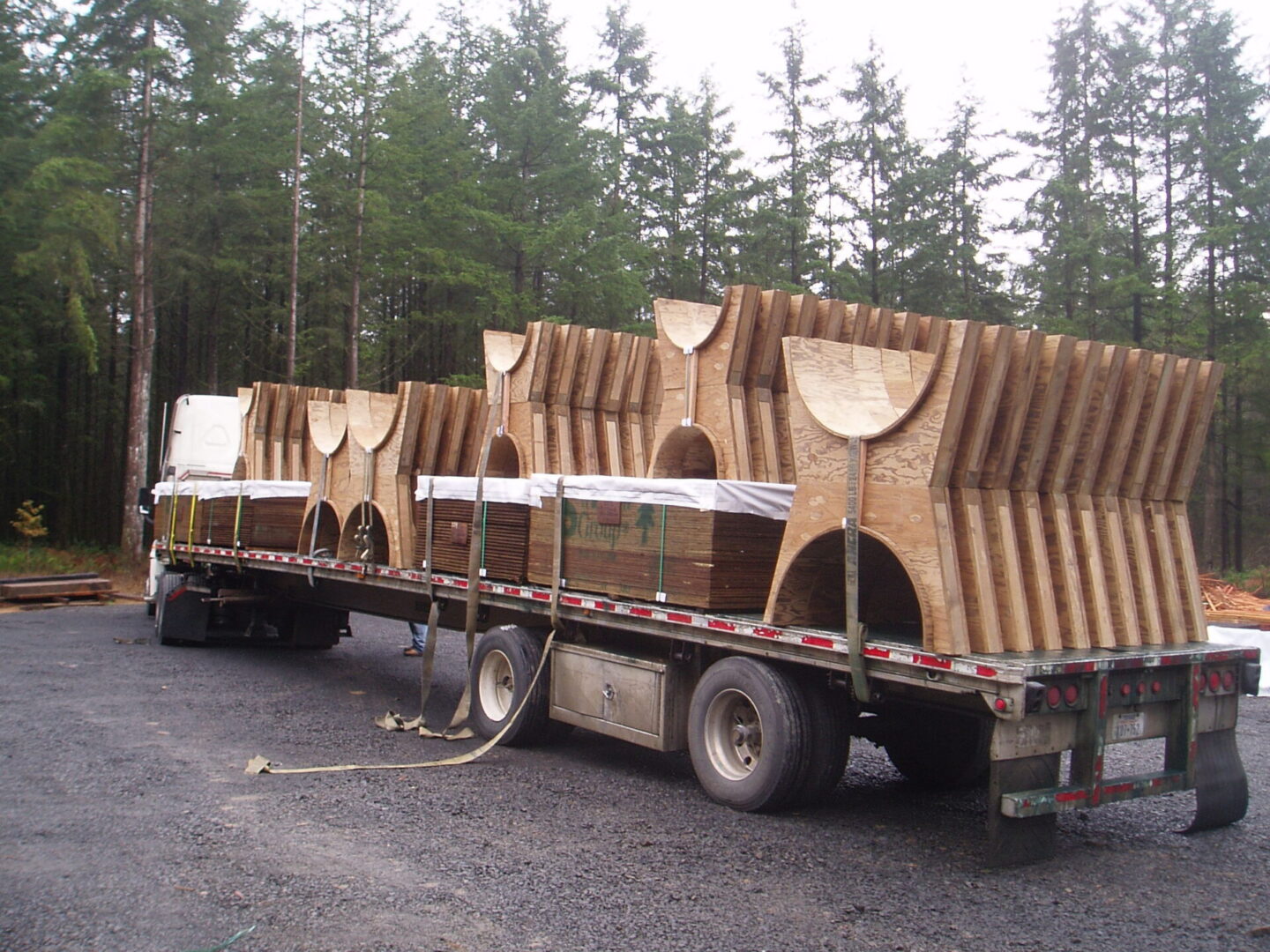 A truck with several wooden structures on it.