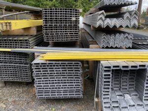 A pile of metal with yellow strips on top.